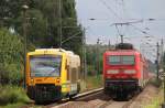 12.7.2014 Rüdnitz. ODEG nach Berlin - Lichtenberg und RE 3 nach Prenzlau mit 143-333 begegnen sich kurz vor dem BÜ in km 28.3 der Berlin-Stettiner Eisenbahn.