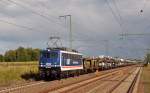 110 043 der PRESS rollte mit einem Autozug aus dem VW-Werk Zwickau-Mosel am 24.08.14 durch Rodleben Richtung Dessau.