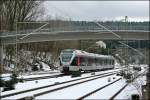 ET23005 erreicht als ABR (RE16  Ruhr-Sieg-Express ) von Siegen komment den Bahnhof Welschen-Ennest.