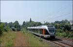 ET22004  HAGEN  hat soeben als ABR33819 (RB40  Ruhr-Lenne-Bahn ) den Harkortsee berquert und strebt dem Ziel Hagen Hauptbahnhof entgegen.