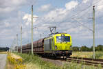 11.07.2024 Idagroden (zwischen Sande und Varel). Erzzug gezogen von Alpha Trains 249 056 (Vectron Dual Mode) auf der Fahrt vom Jade Weserport in Richtung Oldenburg