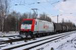 Gleich mit zwei Eigentmerlogos (ITL/Veolia) kam 185 650-9 mit einem Kesselwagenzug durch Leipzig-Thekla gefahren. Fotografiert am 06.03.2010. 