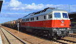 DB Cargo AG mit  232 005-9  (NVR-Nummer: 9280 1 232 005-9 D-DB) und Kesselwagenzug für Kreideschlamm (leer) am 18.09.19 Durchfahrt Bahnhof Flughafen Berlin Schönefeld.