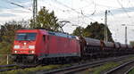 DB Cargo AG, Mainz mit ihrer  185 310-0  [NVR-Nummer: 91 80 6185 310-0 D-DB] und einem Ganzzug Schüttgutwagen am 17.10.24 Höhe Bahnhof Magdeburg Neustadt.