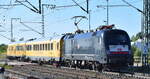 DB Netz Maschinenpool, Berlin mit dem firmeneigenen Taurus  182 524-9  (NVR:  91 80 6182 524-9 D-DBMP ) als Schublok eines Fahrwegmesszuges am 06.08.24 Höhe Bahnhof Rodleben.