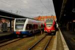 Usedomer Bäderbahn und ein moderner Flirt, 429026 der DB, treffen sich am 13.02.2014 um 10.59 Uhr im Bahnhof Stralsund. Beide Fahrzeuge fahren auf Ostseeinseln. Die UBB fährt nach Usedom bis zum polnischen Swinemünde. Der Flirt fährt nach Binz auf die Insel Rügen.