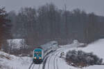 223 061 mit RE 1 München-Hof am 06.12.2023 bei Escheldorf. 