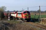 Die STRABAG-Nohab der EIVEL im Santa-Fe Design alias 227 001 am 7.04.2010 mit einer Schwesterlokomotive und 27 Wagen sdlich von Bad Segeberg (Travental-Klein Gladebrgge).