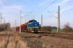 V 2304 (277 404-0) evb Logistik mit einem Holzzug in Demker und fuhr in Richtung Magdeburg weiter.