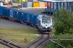 EGP Lok 247 906 mit Containerwagen im Fährhafen von Sassnitz Mukran.