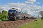 Mit einem Kesselwagenzug am Haken rollt 232 592 der EBS am 05.05.24 durch Greppin Richtung Dessau.