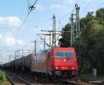 185 630-1 der HGK bei der Durchfahrt mit einem leeren ler in Hamburg-Harburg am 6.07.09.