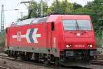 Die 185 604-6 der HGK fhrt Lz durch Kln West am 13.08.2010