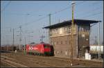 Zur Ruhepause fhrt HGK 145-CL 012 am alten Stellwerk Agf vorbei (gesehen Angermnde 26.02.2011)