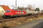 185 632-7 der HGK im Gleiswechselbetrieb in Durchfahrt Zwingenberg an der Bergstrasse am Morgen des 12. Mrz 2011.