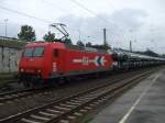 145-CL 012 (145 090-7) durchfhrt mit einem Autozug den Brackweder Bahnhof.