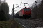 185 605-3 Alpha Trains fr Hfen und Gterverkehr Kln AG [HGK 2063] mit einem Kesselzug  Umweltgefhrdender Stoff, flssig)  bei Nennhausen und fuhr in Richtung Wustermark weiter.