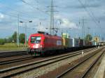 1116 238-5 der ITL mit einem Containerzug mit neuen Wagen bei der Durchfahrt in Berlin Schnefeld Flughafen am 28.08.