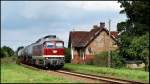 Lautstark bewältigt 232 004-2 mit ihrem Kesselzug die lange Steigung von Szczecin in Richtung Angermünde und unterbricht dabei am 13.08.2011 für einen Moment die stille Idylle in