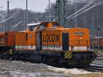 Locon 211 (293 502-1) mit einem Schotterzug am 14.01.2013 in Aachen West.