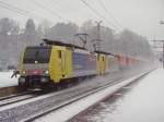 189-er Tandem,mit Winner Spedition Sattelauflieger bei Kirchbichl.Die Stromabnhmer sind ungnstig aufgehoben.28.01.2010