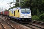 Durchfahrt am 13.08.2014 von der Lz fahrenden 246 005-3 von metronom in Richtung Hafen/Hbf.