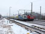 Parallelfahrt der RB 14 nach Nauen mit 143 306-9 und des ODEG-RE4 nach Rathenow mit 1116 911-7.