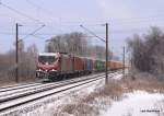 Mein 1300. Bild bei BB.de! Zusehen ist die leicht mit Schneebedeckte 186 133-5 der OHE, die am 3.01.10 einen recht langen Containerzug aus Hamburg-Waltershof durch Hamburg-Moorburg Richtung Sden bringt.