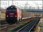 OHE 330087 mit leeren Holzwagen bei der einfahrt in den Rostocker Seehafen.