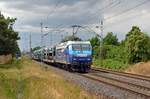 145 030 der PRESS führte am 27.06.23 einen teilweise beladenen VW-Autozug durch Wittenberg-Labetz Richtung Falkenberg(E).