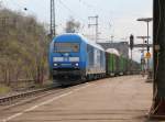 PRESS 253 015 (223 052-2) mit vollem Holzzug in Fahrtrichtung Norden.