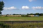 145 023-6 PRESS (145 083-2) mit einem leeren Hackschnitzelzug aus Richtung Wittenberge kommend in Stendal. 31.05.2014