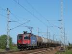 RE 421 378 mit einem Kesselzug bei der Durchfahrt durch die Ausweichstelle Stralsund-Langendorf.