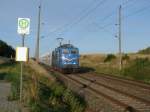 Zwischen Samtens und Rambin an der Bushaltestelle Rothenkirchen fotografierte ich,am 24.Juli 2013 die SRI 151 170 mit dem Kreidezug.