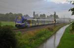 Ein Meridian ET304 in strömenden Regen bei Übersee am Chiemsee in Richtung München am 15.08.14.