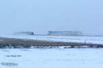 Kreuzung zweier Zge der Nord-Ostsee-Bahn am zweiten Januar auf dem winterlich verschneiten Hindenburgdamm nach Sylt am 2.