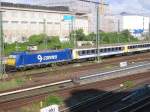 Ein Flensburg-Express der Nord-Ostsee Bahn (NOB) wird am 16.07.2005 von einer BR 185 aus Hamburg Hbf geschoben.