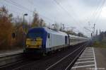 DE 2000-02 (223 054-8) der NOB - Nord-Ostsee-Bahn GmbH mit dem (NOB81714) von Hamburg-Altona nach Westerland(Sylt) in Elmshorn. 08.11.2011