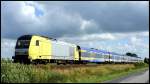 ER20-011 der Nord-Ostsee-Bahn mit den Nordsee Werbewagen unterwegs nach Westerland (Sylt) am 31.07.13 bei Langenhorn