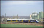 Ein unbekannter dreiteiliger Talent der NordWestBahn ist hier vor der Kulisse der Zementwerke in Lengerich am 2.4.2004 als Überführungsfahrt unterwegs nach Münster.