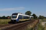 648 573 und 648 585 fahren auf dem noch nicht modernisierten Teilstück der Bahnstrecke Oldenburg - Wilhelmshaven bei Sande in Richtung Oldenburg. Fotografiert am 04.07.2014. 