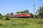 DB Gebrauchtzug 111 011-3 fährt mit ihrer TRI-Ersatzgarnitur als RB17c nach Bretten und verlässt hier gerade den Haltepunkt Bruchsal Schlachthof.