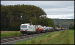 Die nagelneue Vectron TXL 7193 300  START NOW. nature  ist im Einsatz. Hier befördert die Maschine am 03.10.2024 einen KLV-Zug bei Retzbach durch das Maintal gen Süden.