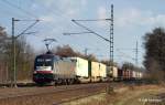 ES 64 U2-029 TX Logistik bringt am 20.03.11 den Fischzug Rotterdam - Oslo durch Halstenbek vorbei an der Baumschule Richtung Padborg.