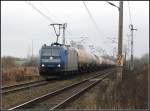 Br 185 510-5 von TX-Logistik mir einem Kesselzug beim verlassen von Rostock.