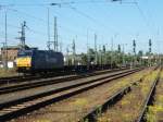 Die 185-CL 003 der Veolia Cargo fhrt am 4.5.2007 mit einem leeren  Samms-Zug durch den Bf Lutherstadt Wittenberg.