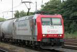 Die 185-CL 003 der Veolia mit Werbung durchfhrt Kln West am 04.07.2009