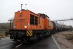 293 021-2 mit Kesselzug von Rostock-Seehafen nach Stendell bei der Ausfahrt im ltanklager.02.12.2012 