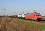 101 075 mit der Überführung einer Stadler Euro 9000 bei Hürth-Fischenich am 07.03.2021