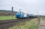 248 021 mit einem Kesselzug Richtung Süden bei Kerzell am 13.11.2024